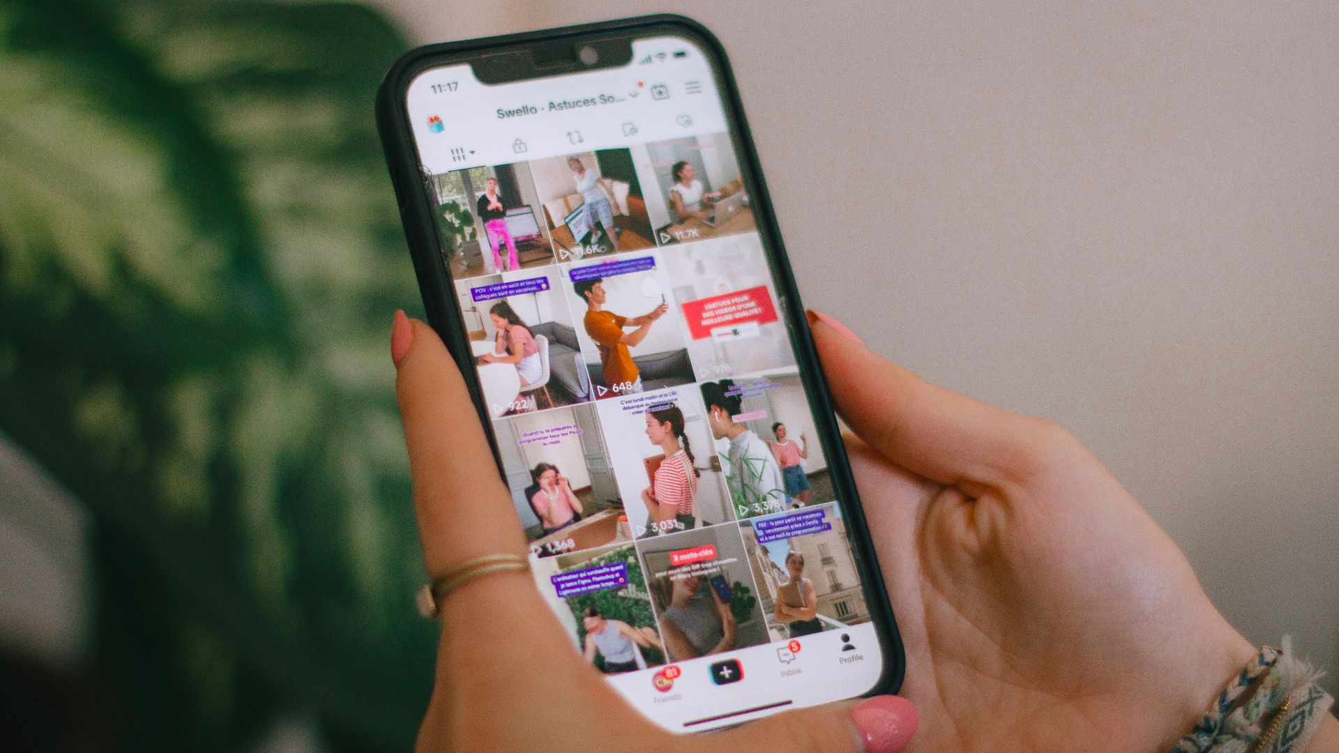 A person holding a cell phone in their hand