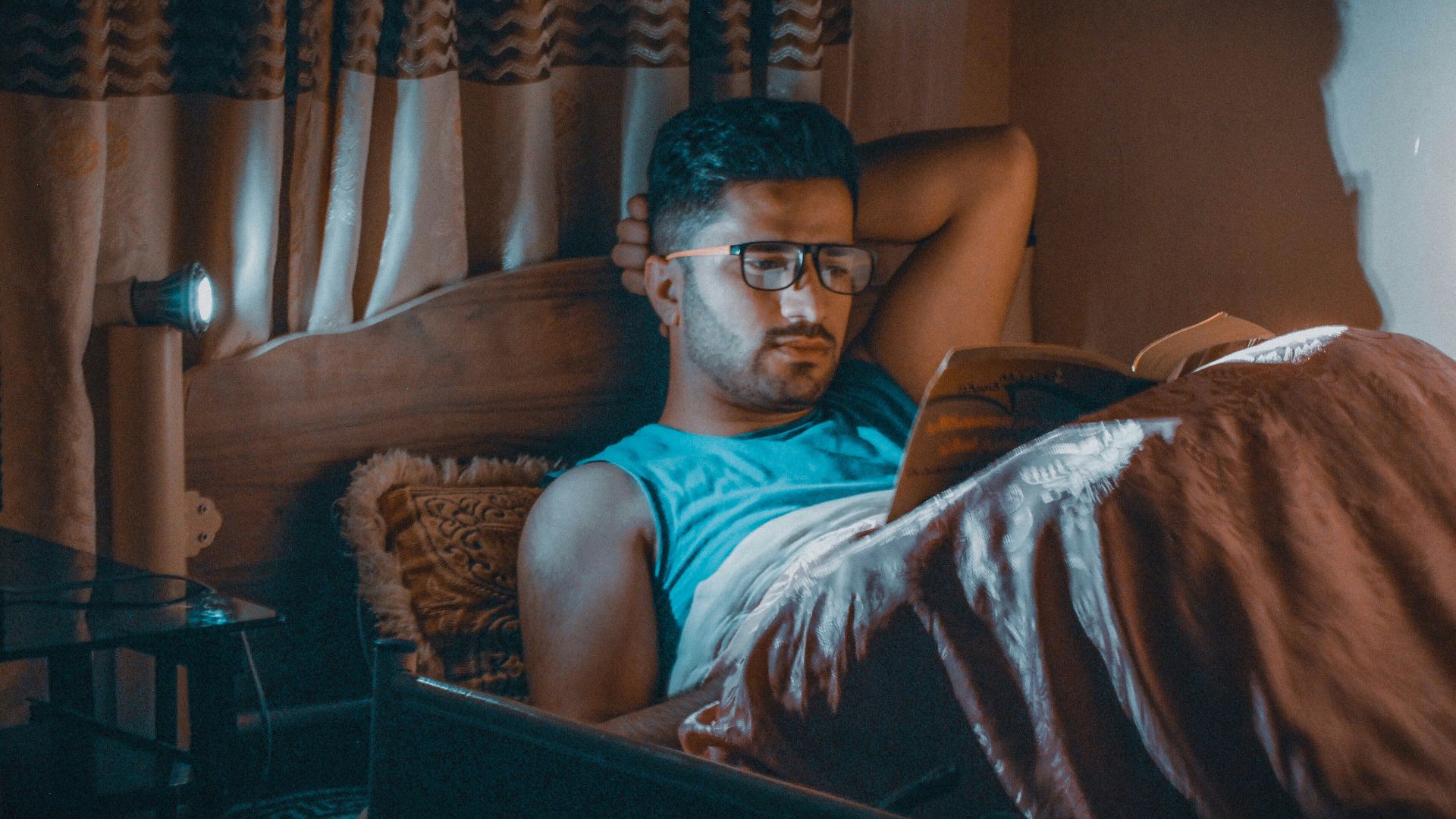 a man sitting in a chair with a laptop