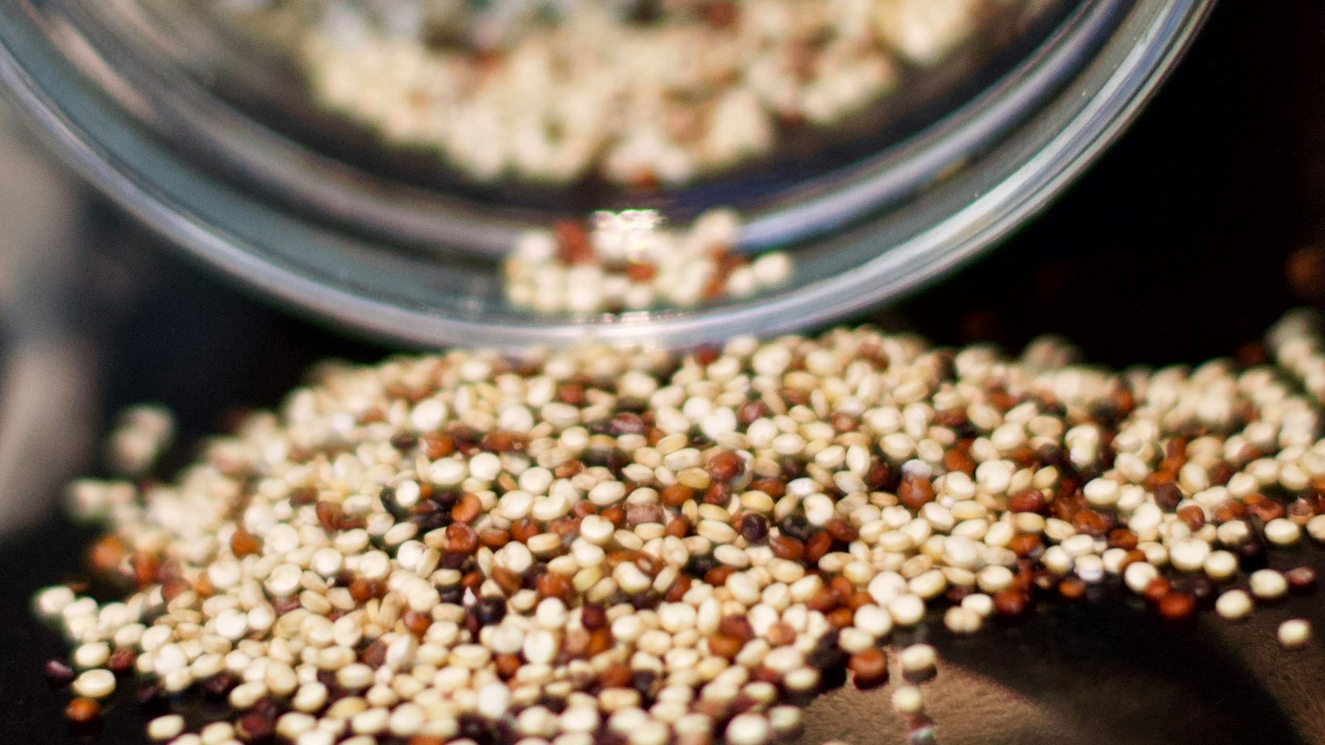 brown coffee beans in clear glass jar