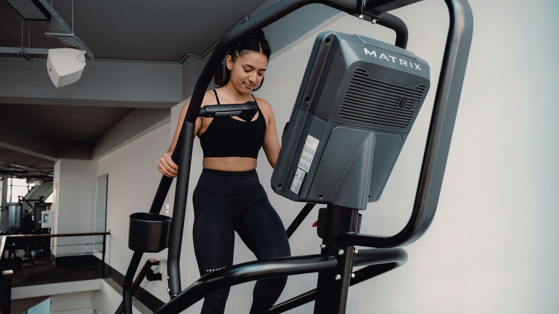 A woman on a treadmill in a gym