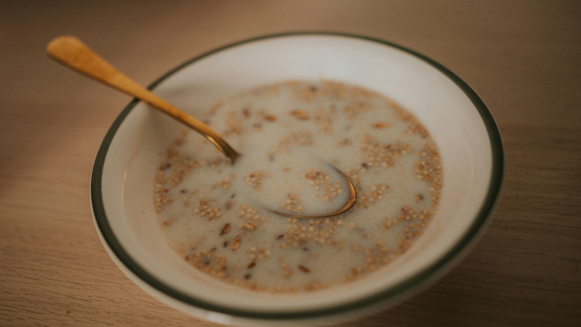 a bowl of cereal with a spoon in it