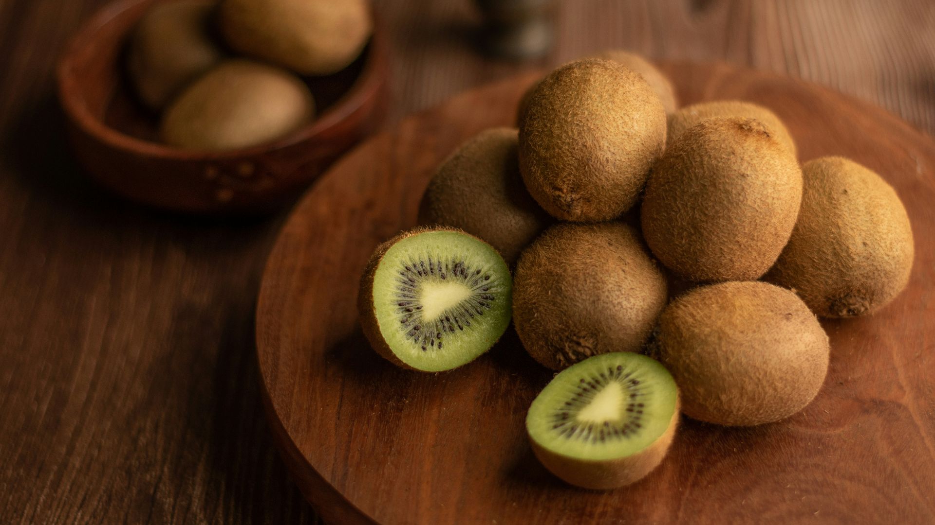 brown round fruit on brown wooden table