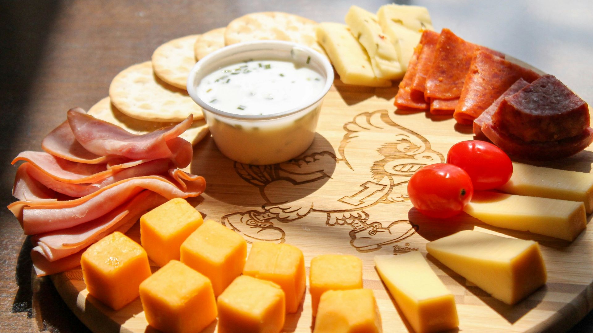 sliced cheese and red tomato beside white ceramic bowl with milk
