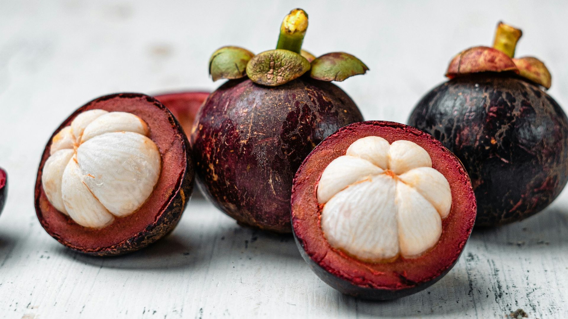 red round fruit on white table