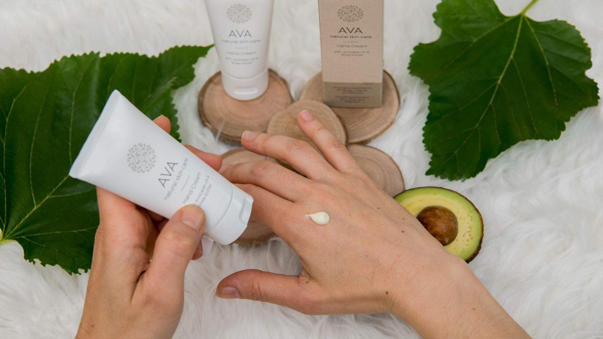 person holding white plastic tube bottle