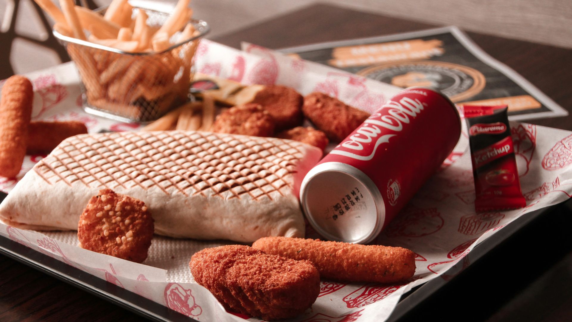 red and white coca cola can beside brown bread on white ceramic plate