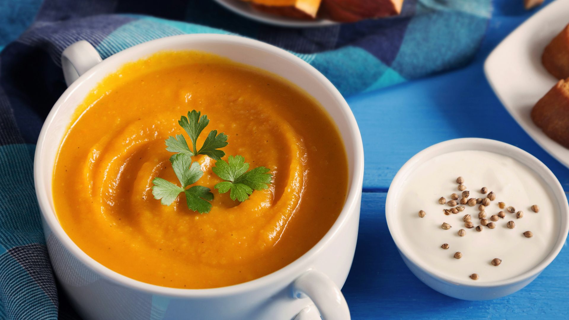 a cup of tea next to a plate of pastries