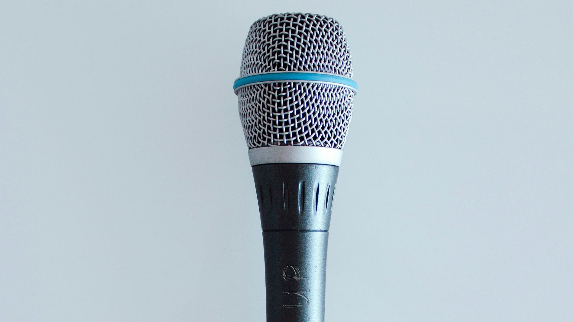 black and gray corded microphone
