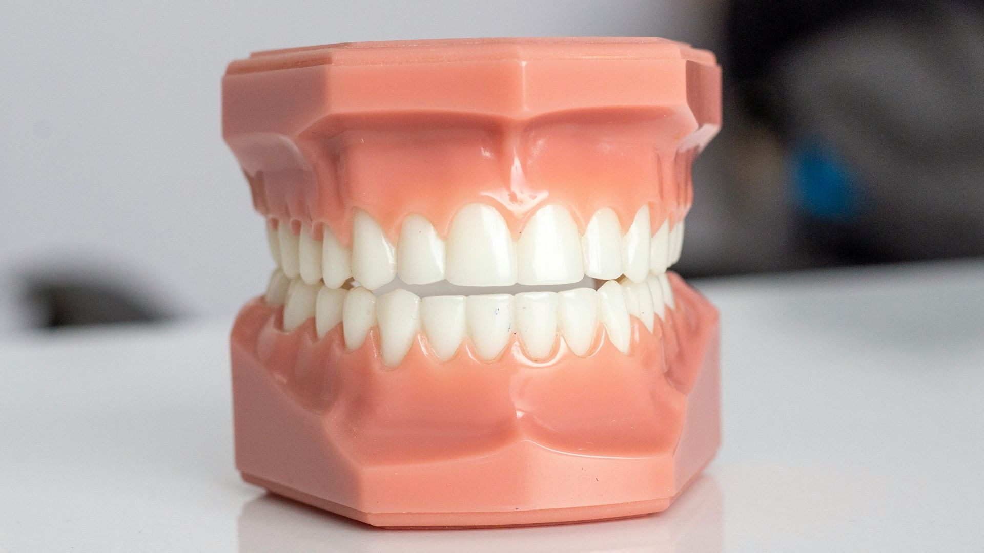 orange plastic container on white table