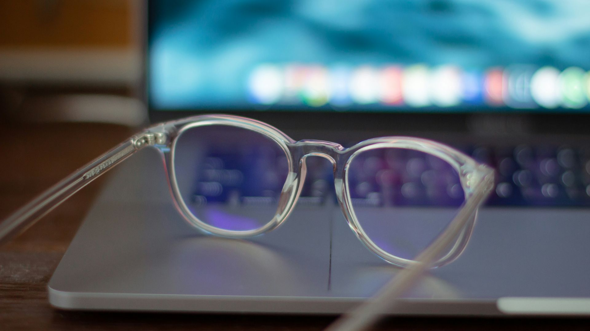 silver framed eyeglasses on white table