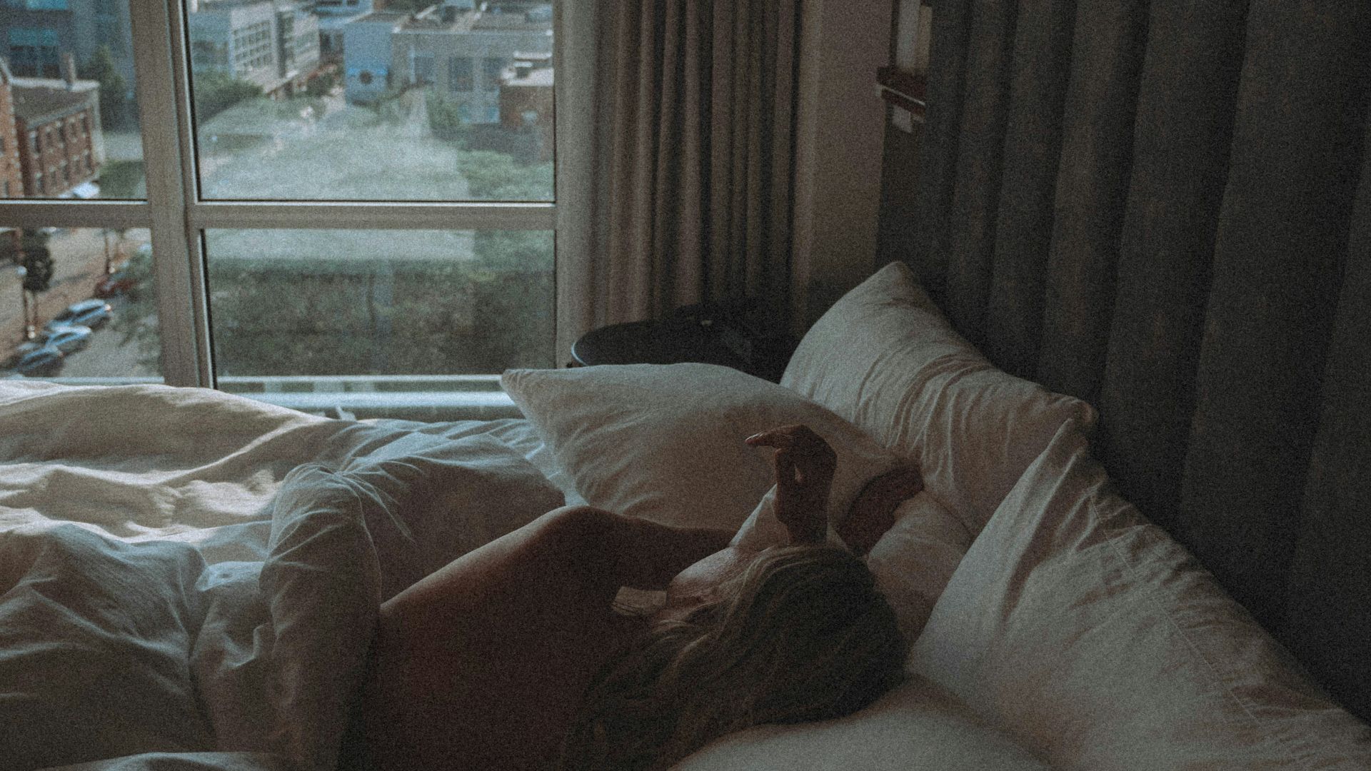 white bed linen on bed