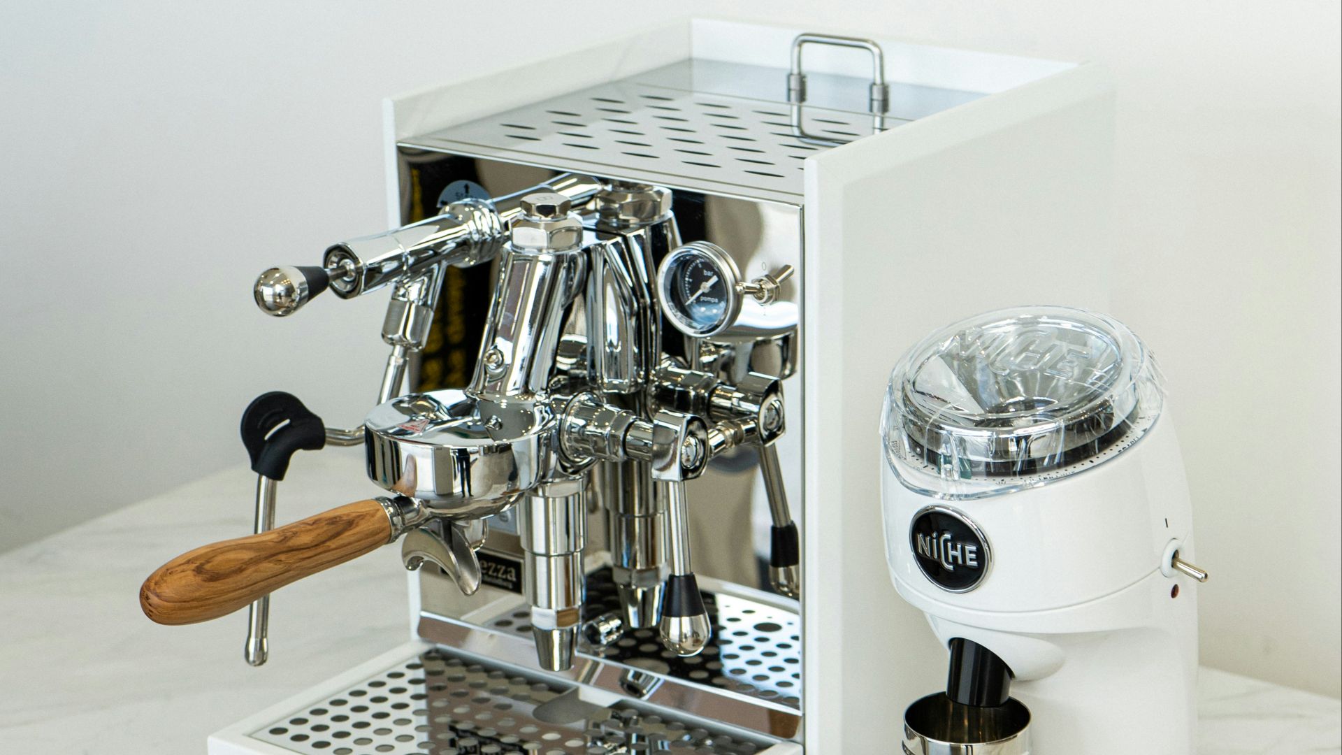 a coffee machine sitting on top of a white counter