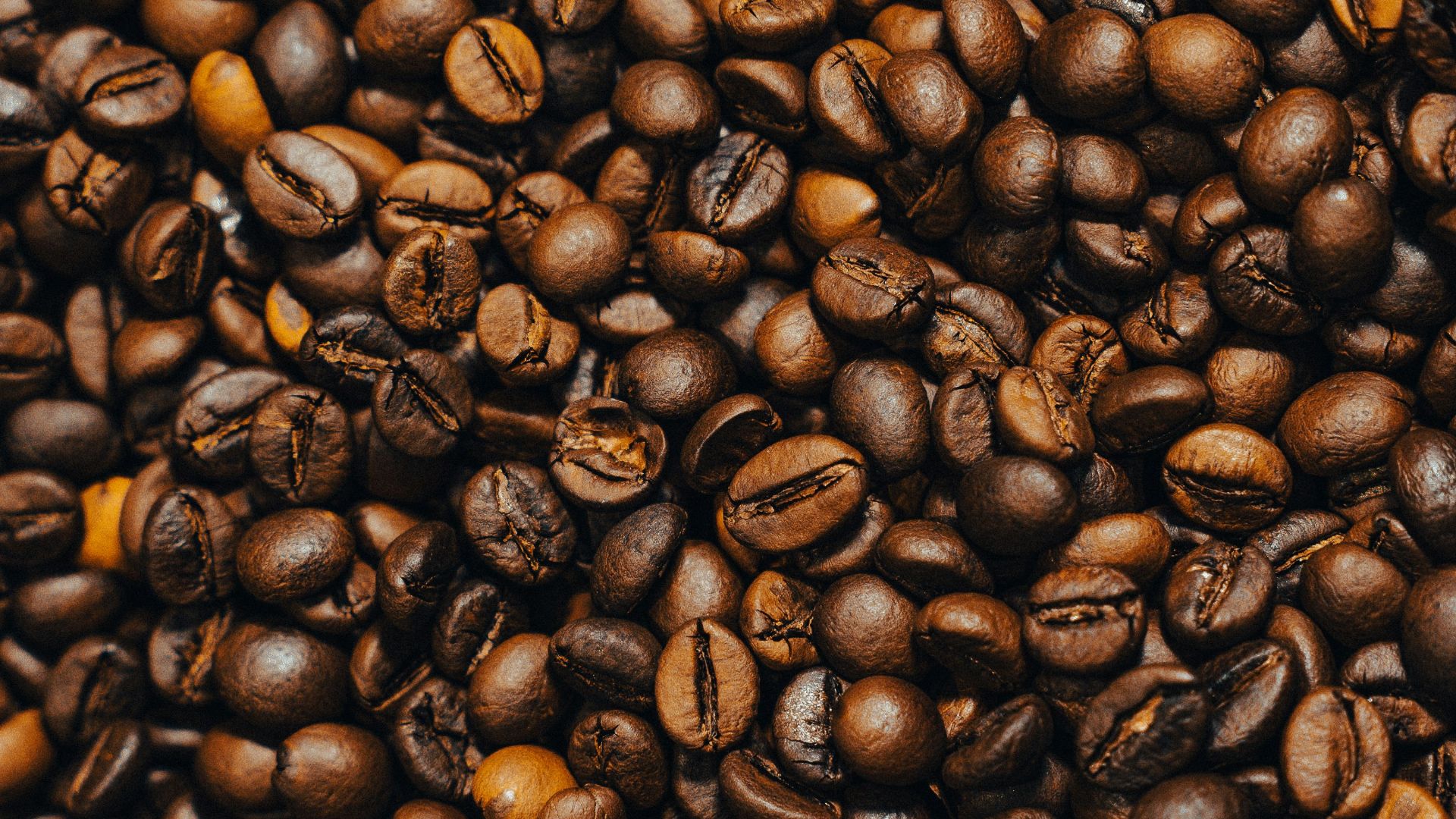 a pile of coffee beans and coffee beans