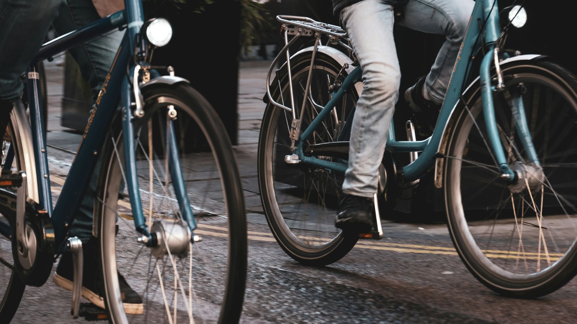two people riding bicycles