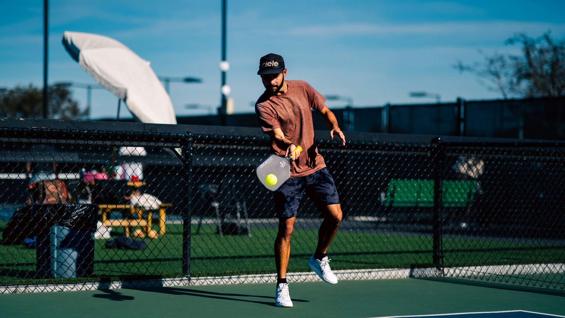 A man on a tennis court holding a tennis racket