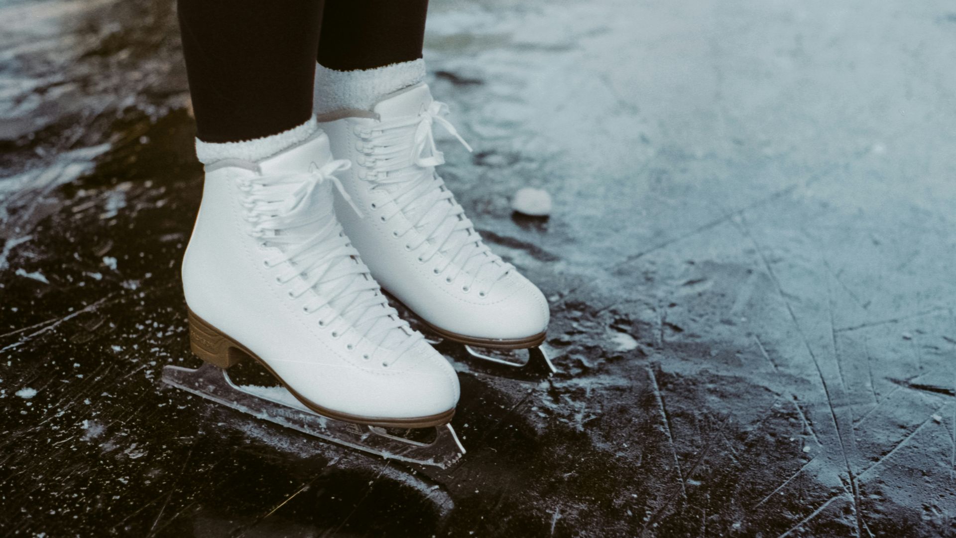 person wearing white leather boots