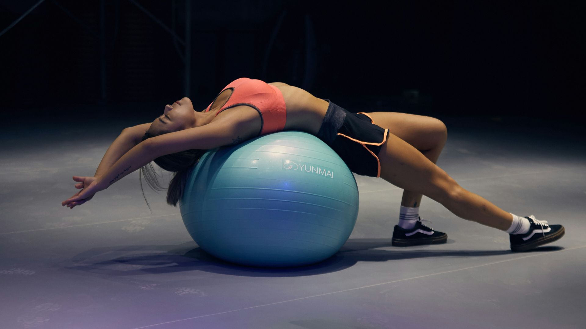woman doing yoga on stability ball