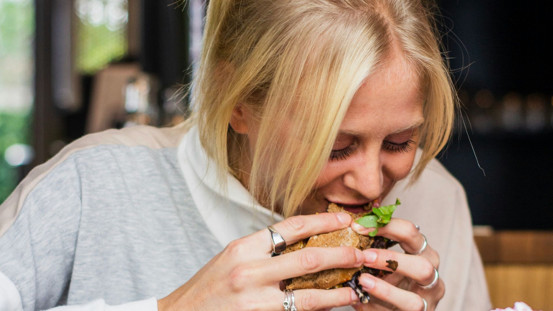 woman eating burger