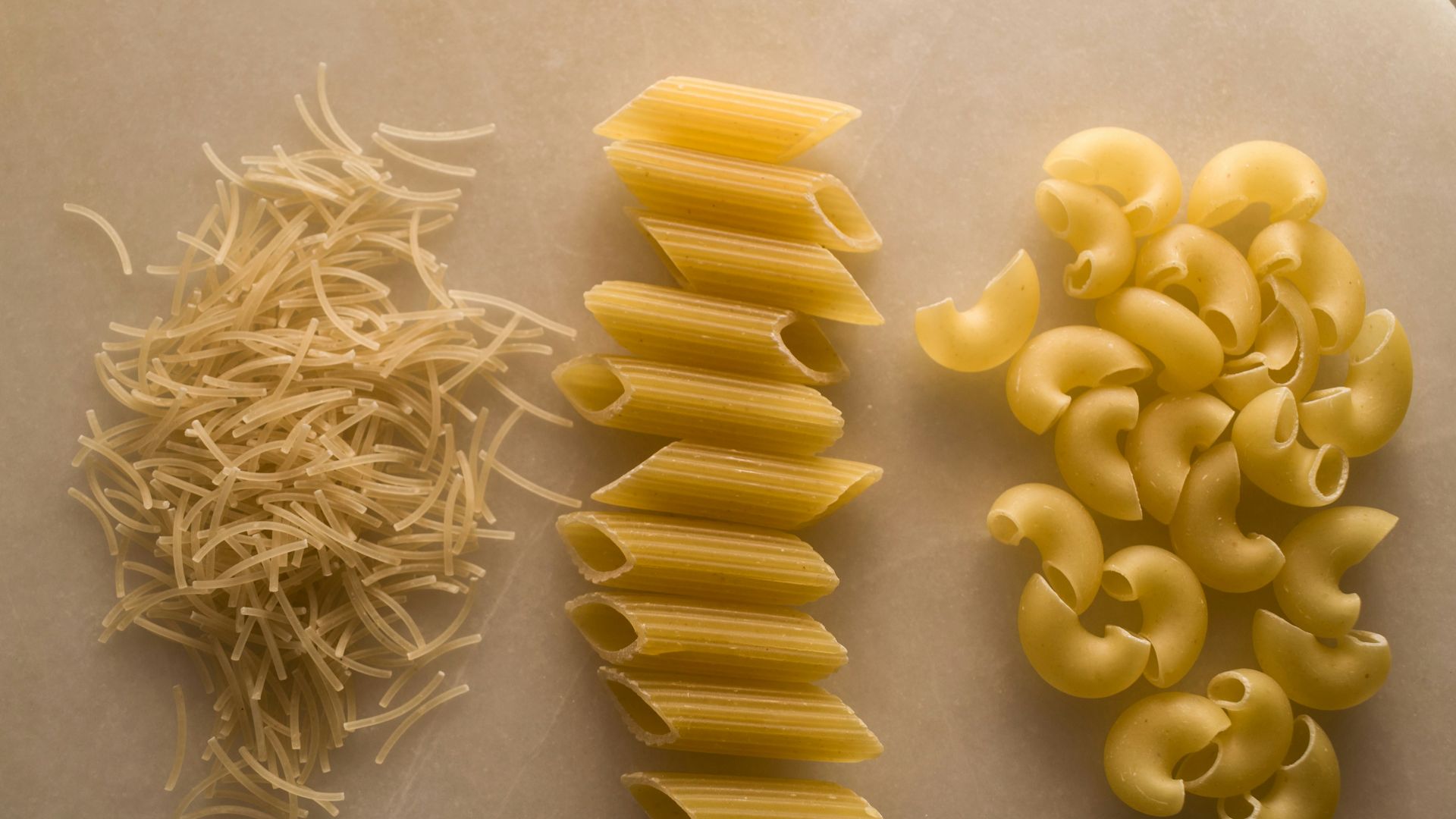 yellow pasta on white table
