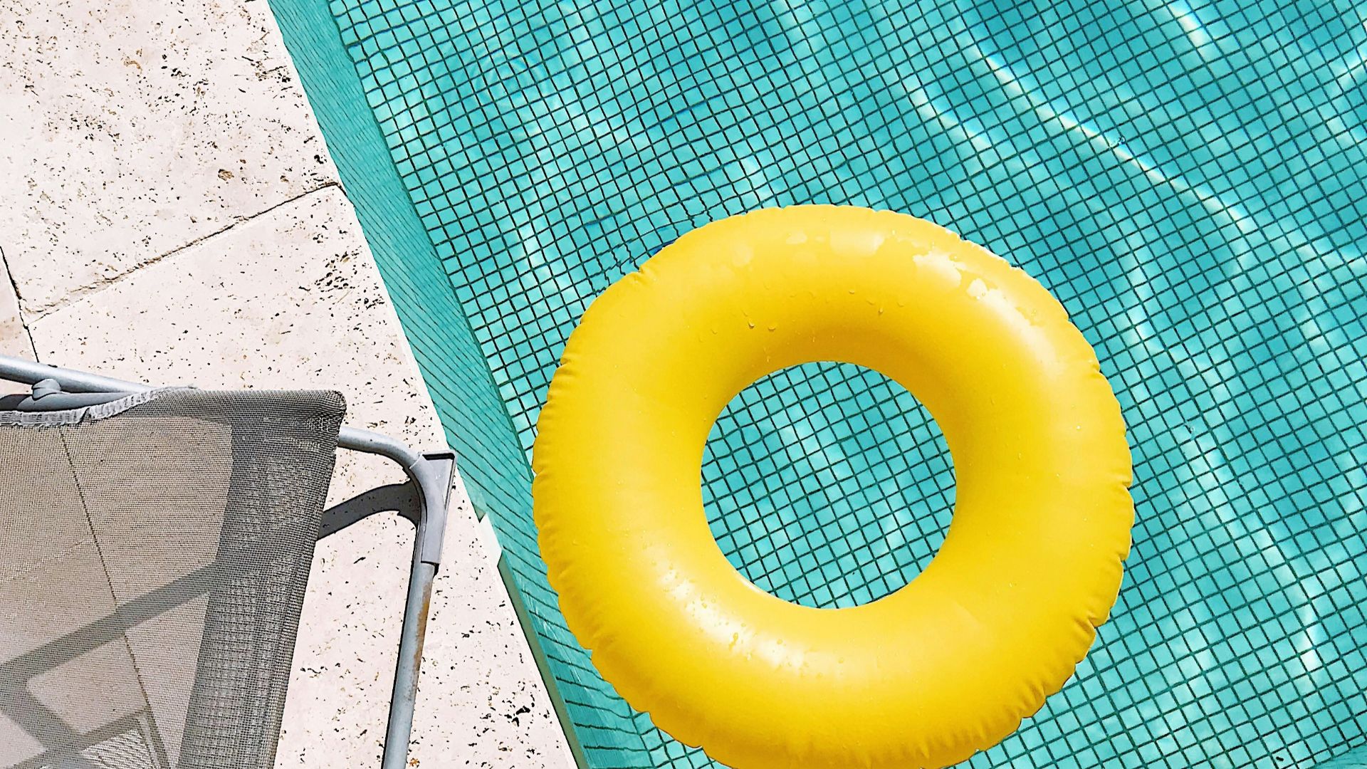 yellow plastic round toy on green table