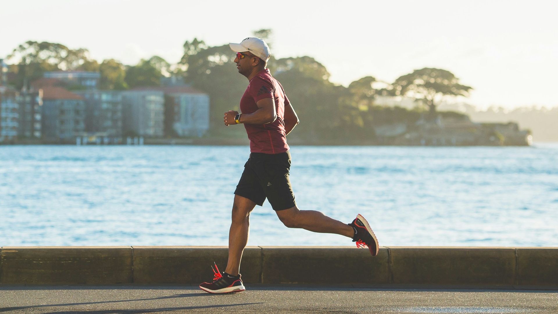 man running near sea during daytime