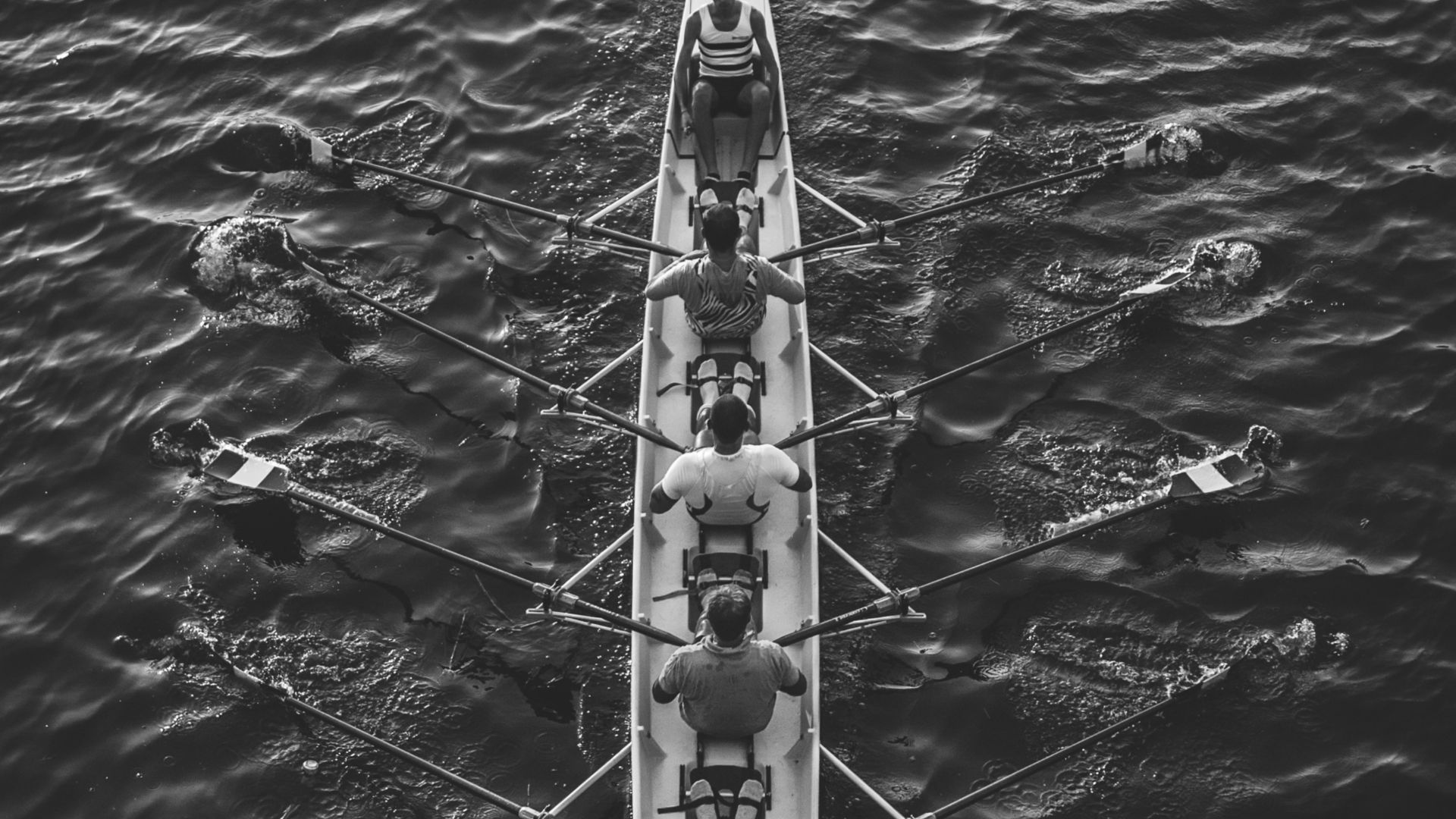people riding boat on body of water