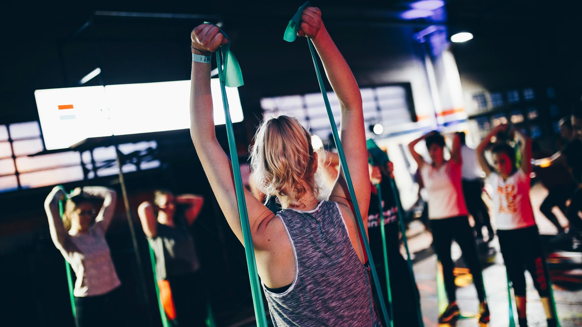 group of people in gym while exercising