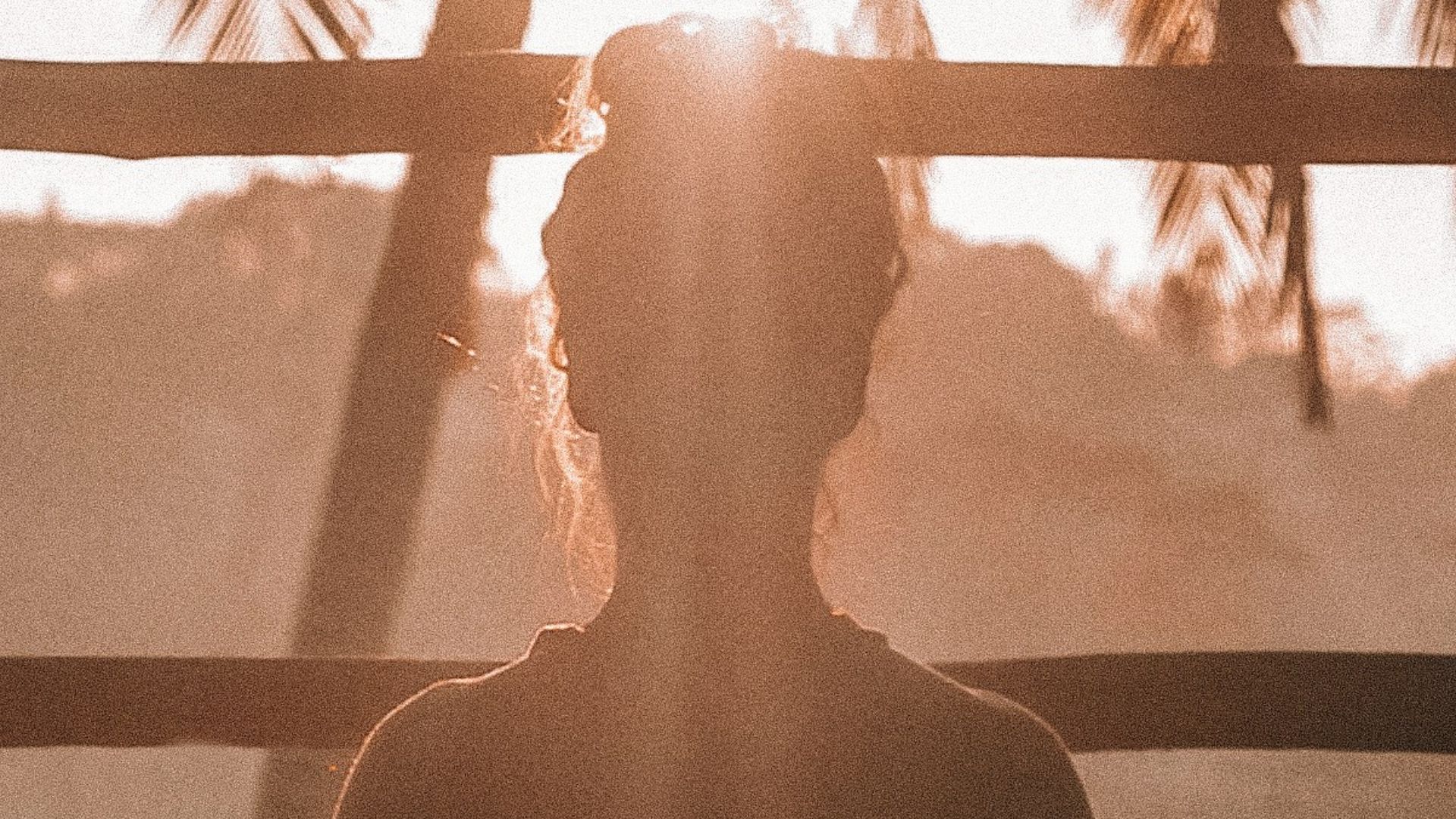woman doing yoga meditation on brown parquet flooring