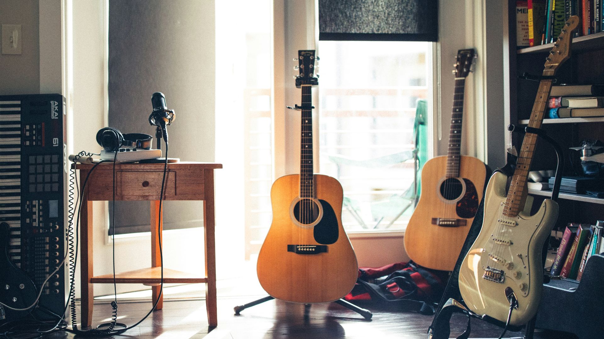 several guitars beside of side table