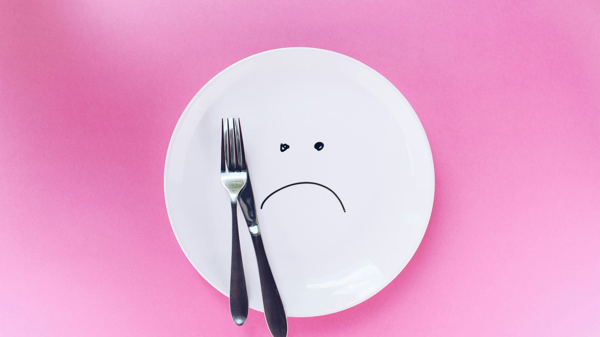 silver fork and knife on plate