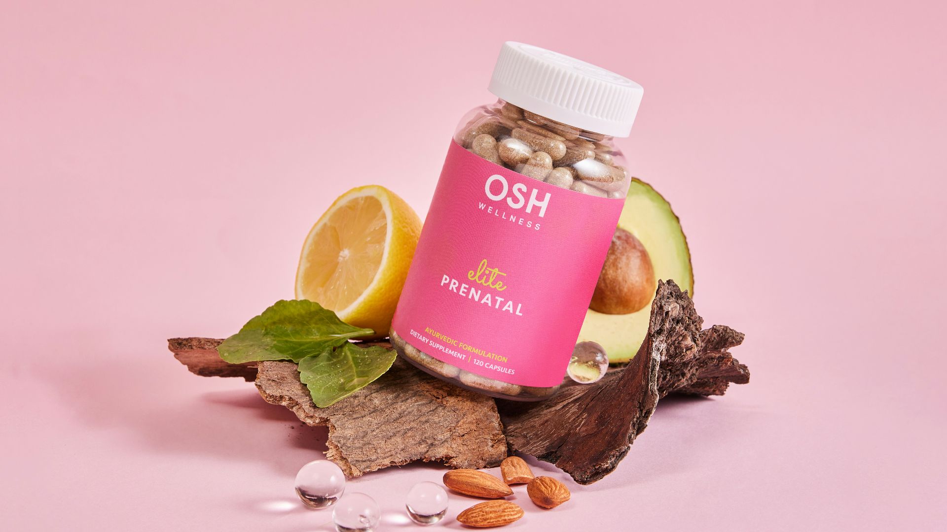 A jar of vitamins sitting on top of a pile of rocks