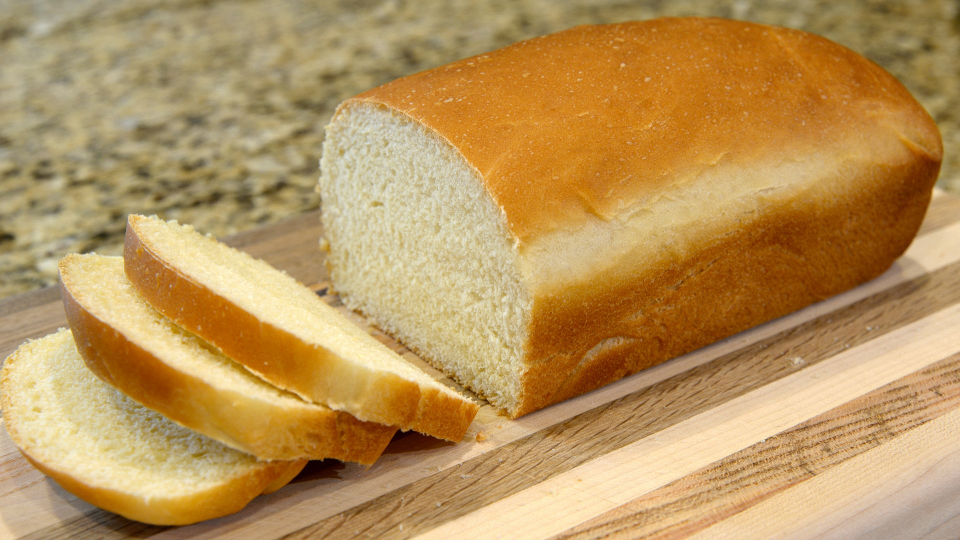 bread on brown wooden chopping board
