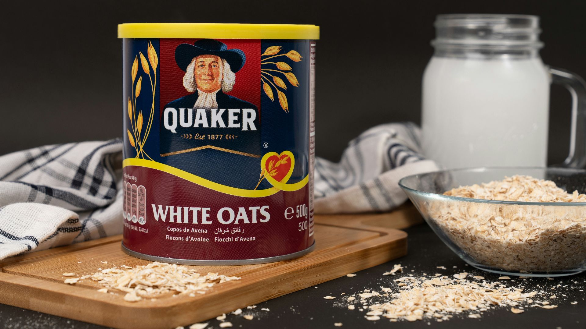 A can of oats next to a bowl of oats