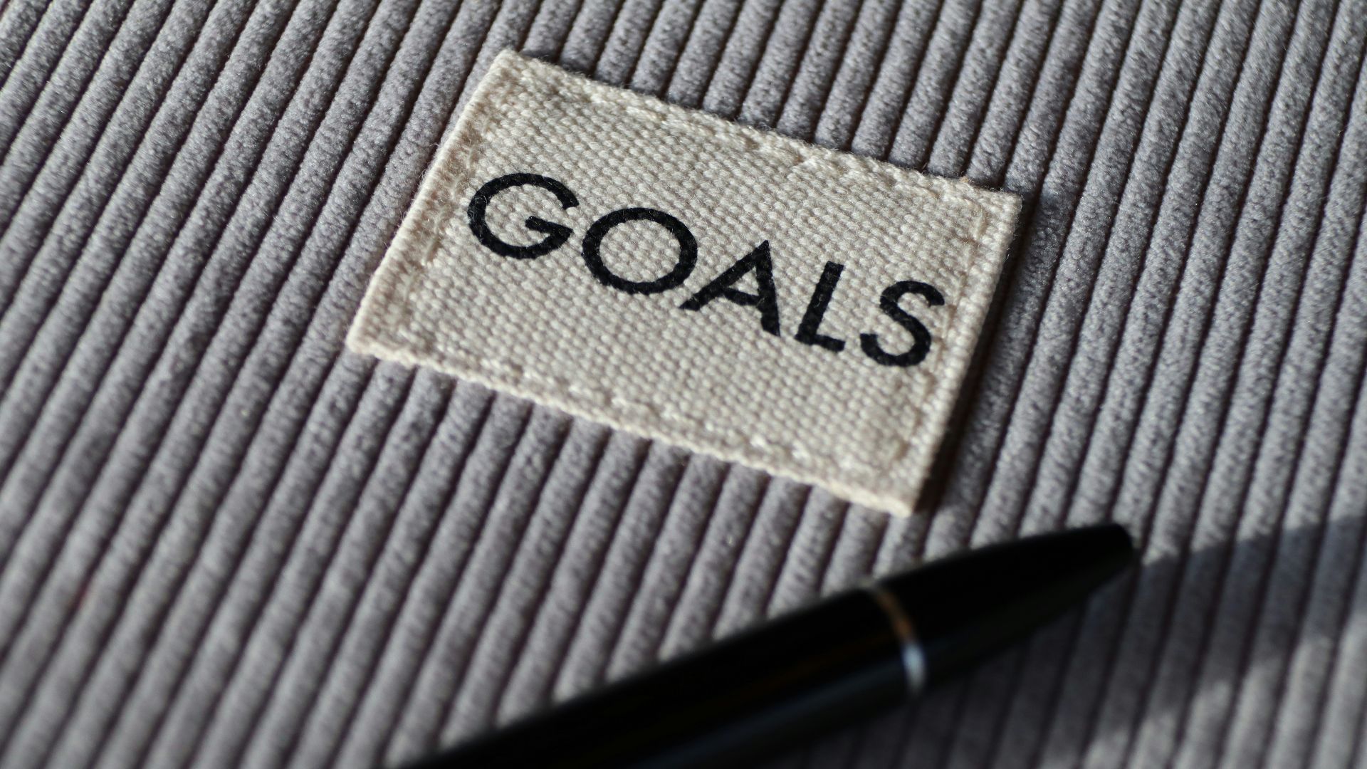 black and silver pen on gray textile