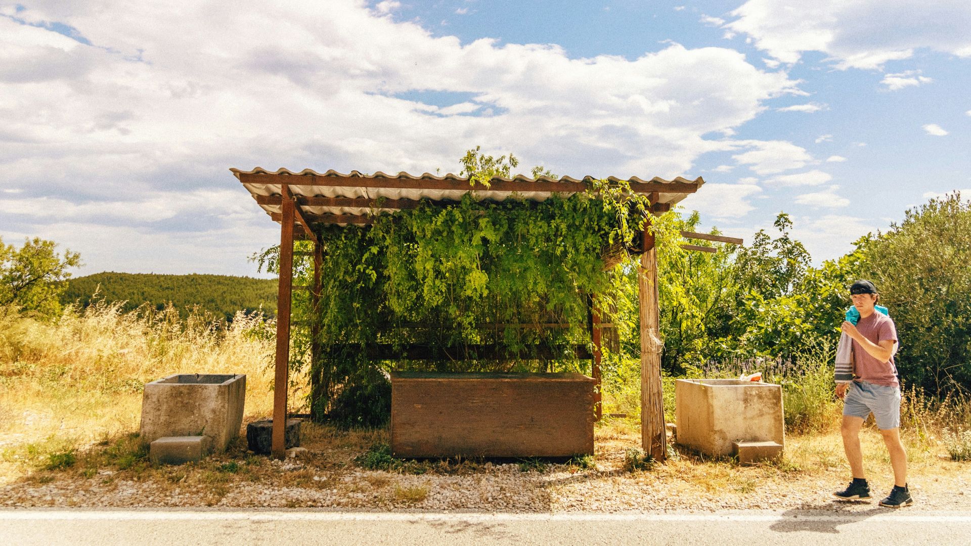 a person standing next to a structure outside