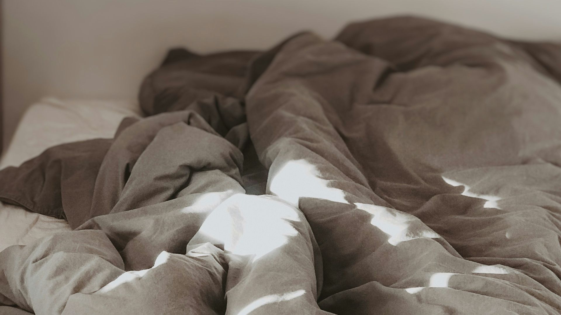 brown and white bed linen