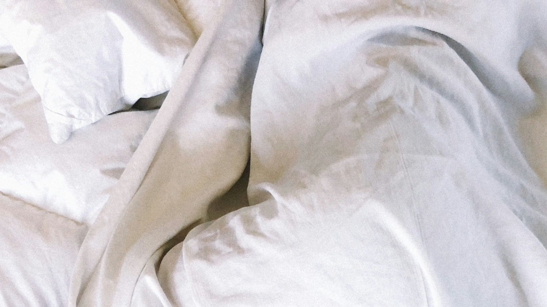 woman covered with white blanket