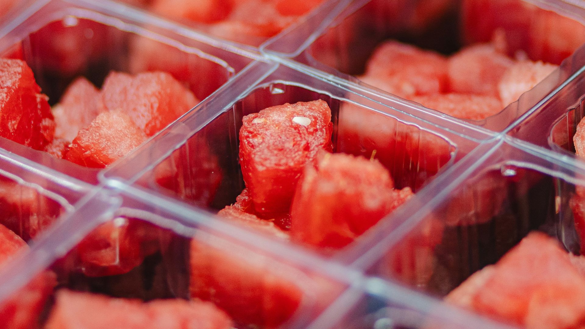 Diced watermelon in clear plastic containers