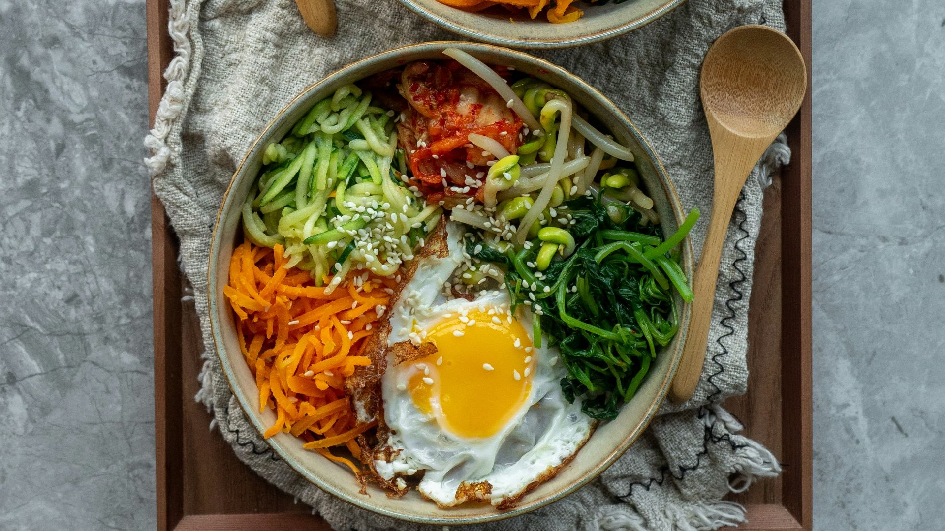 brown wooden ladle and white ceramic bowl with soup