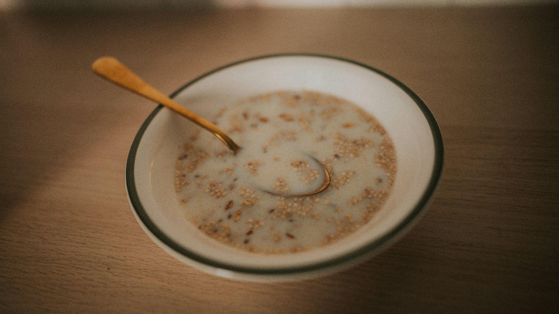a bowl of cereal with a spoon in it