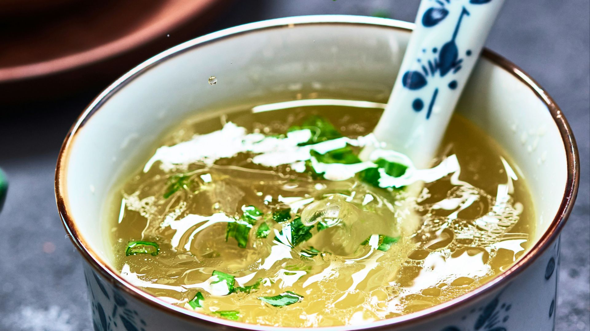 a bowl of soup with a spoon