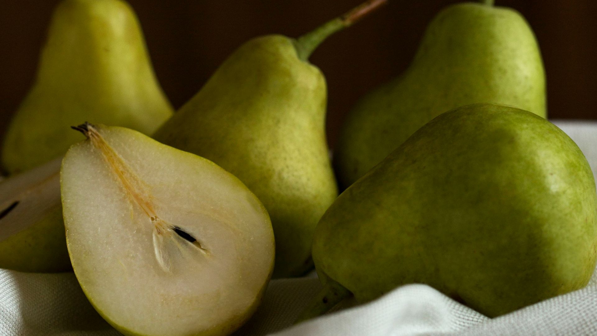 green apple fruit on white textile