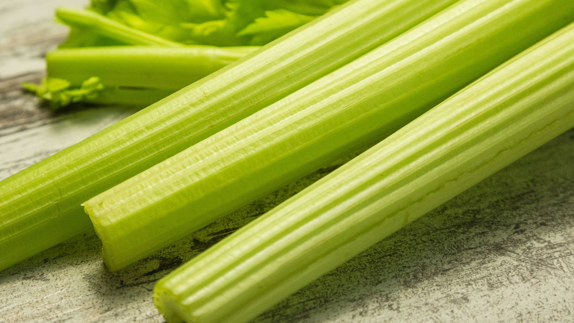 green vegetable on gray wooden table