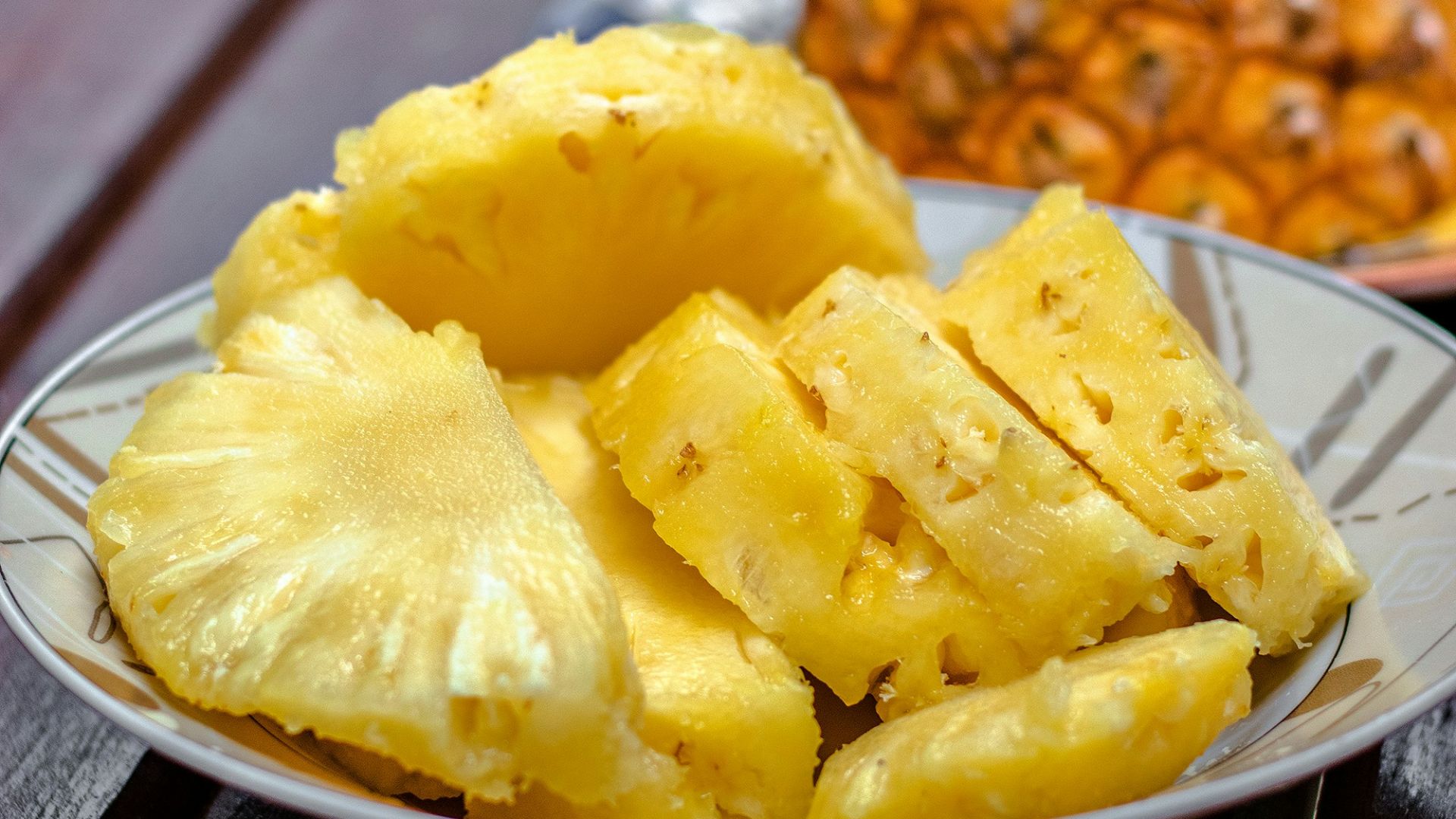 sliced pineapple on white ceramic plate