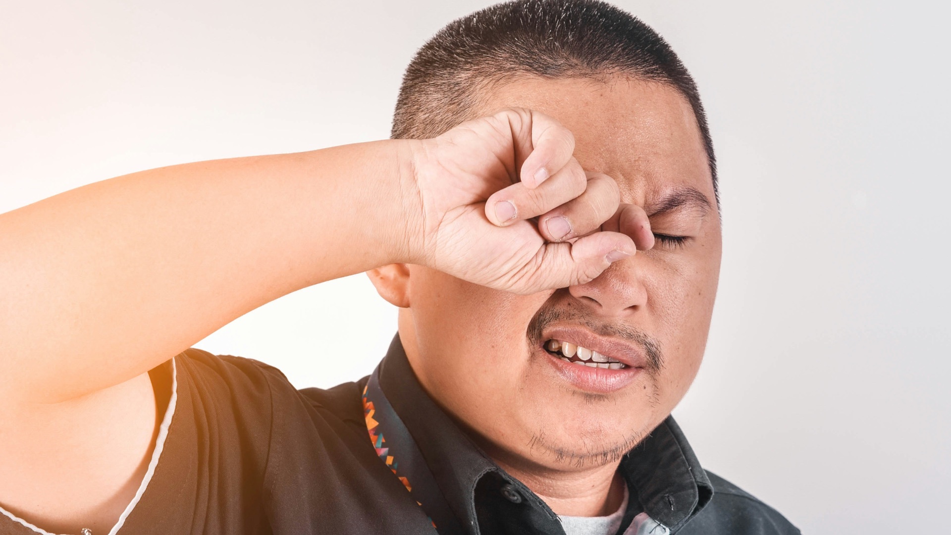 man wearing black collared shirt