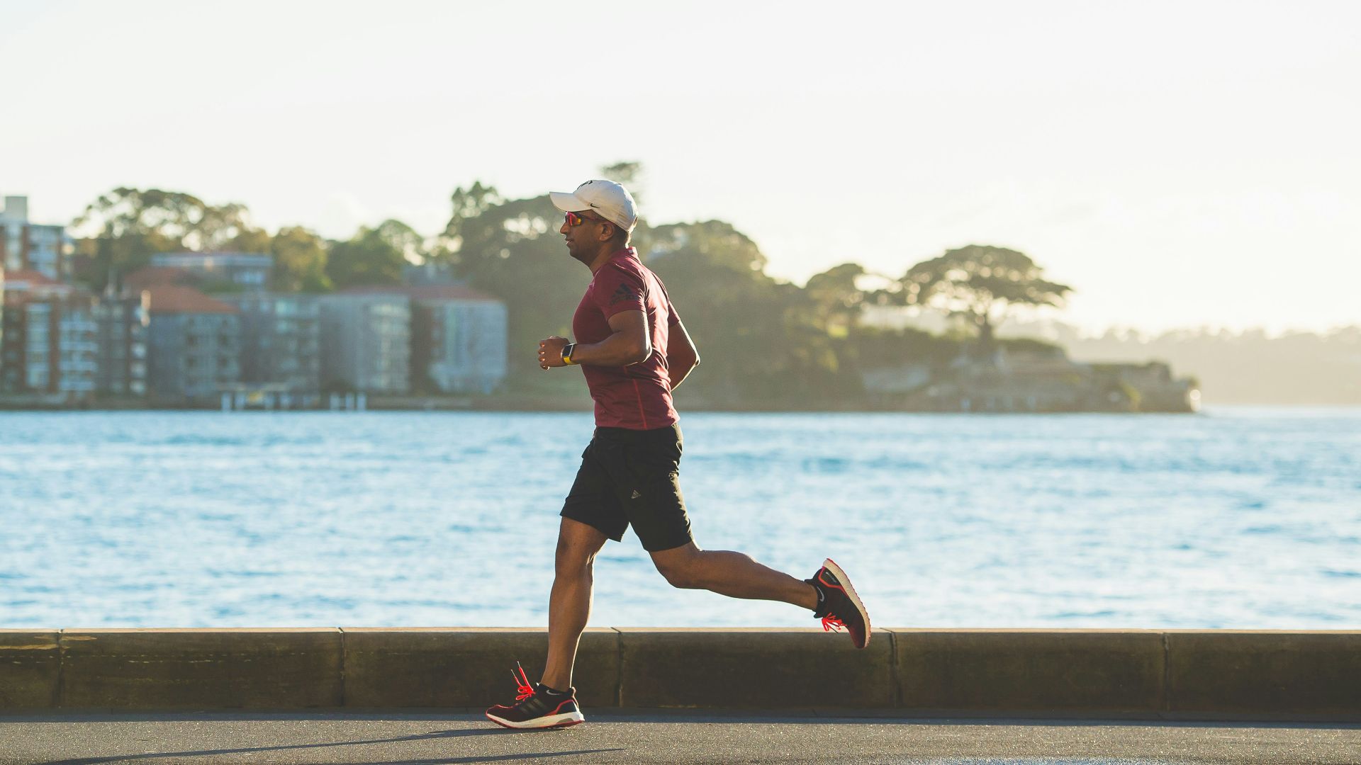 man running near sea during daytime