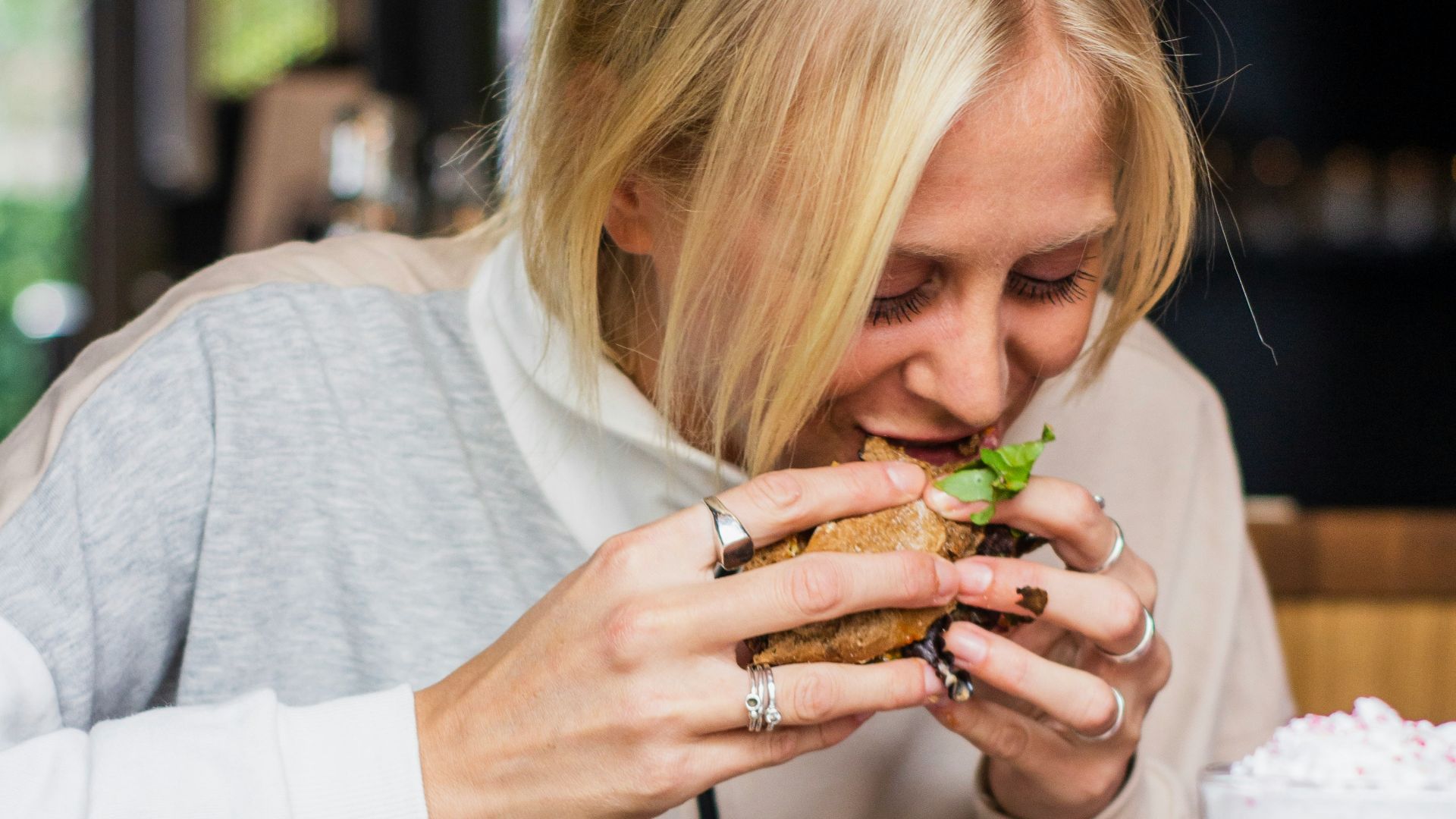 woman eating burger