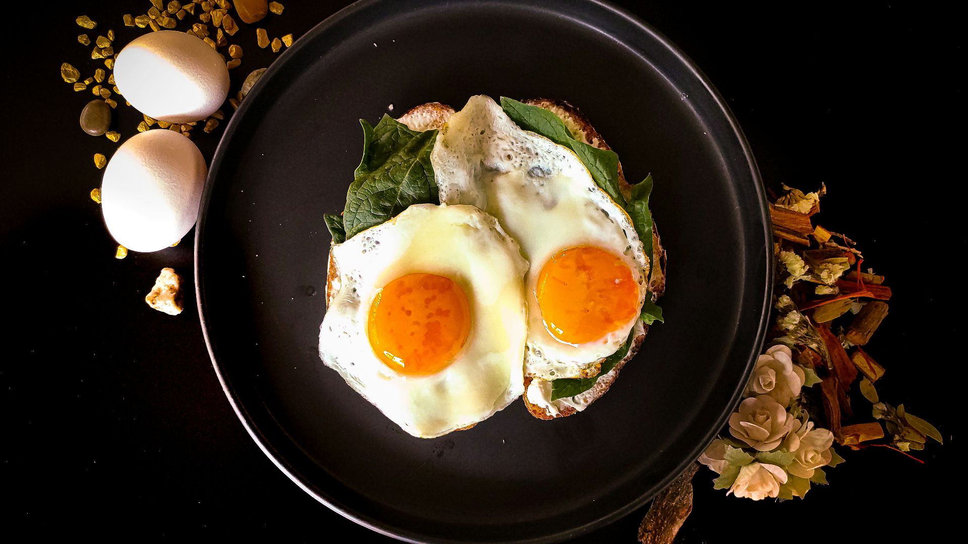 sunny side up egg on black ceramic plate