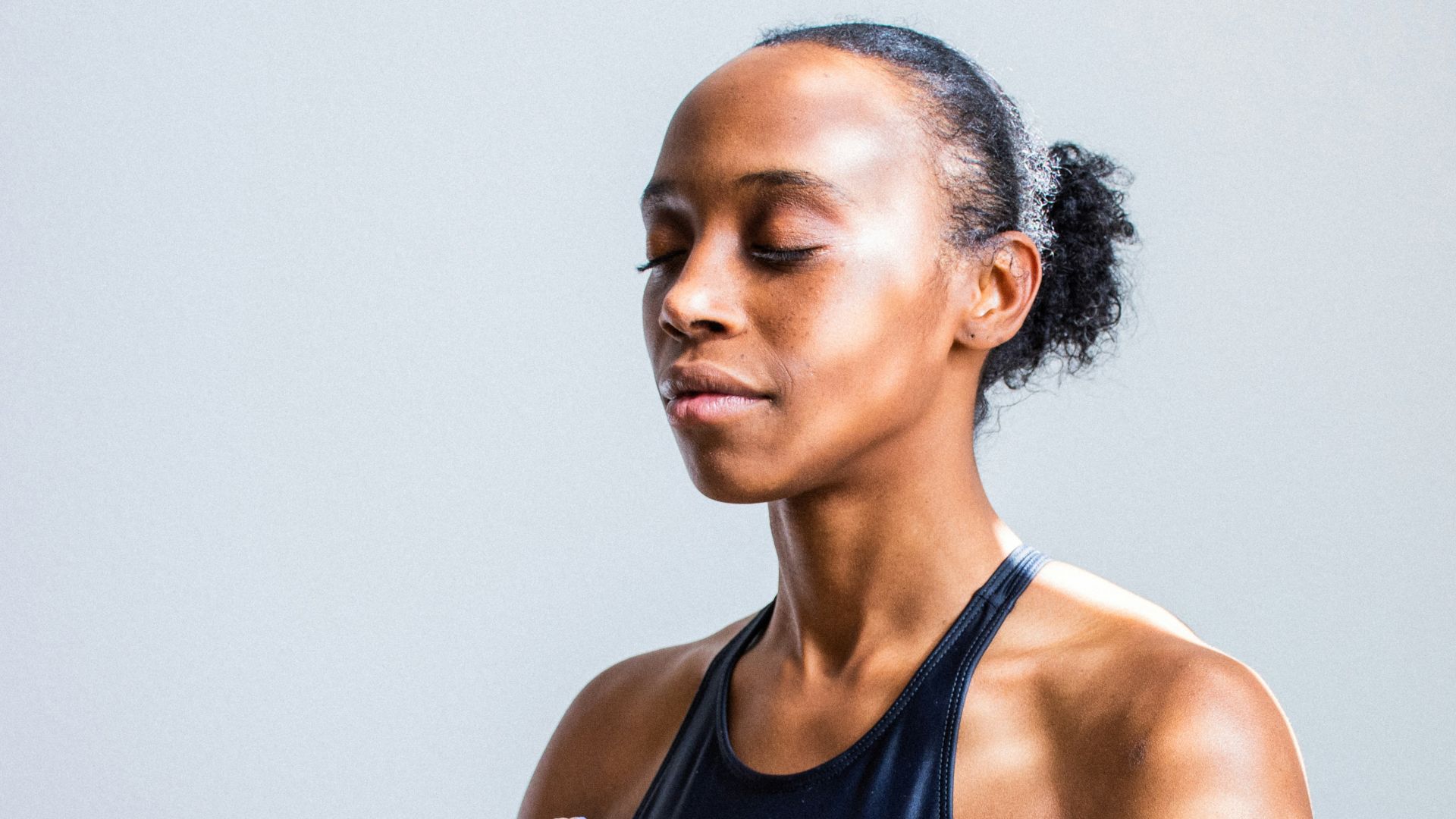 woman wearing black sports bra