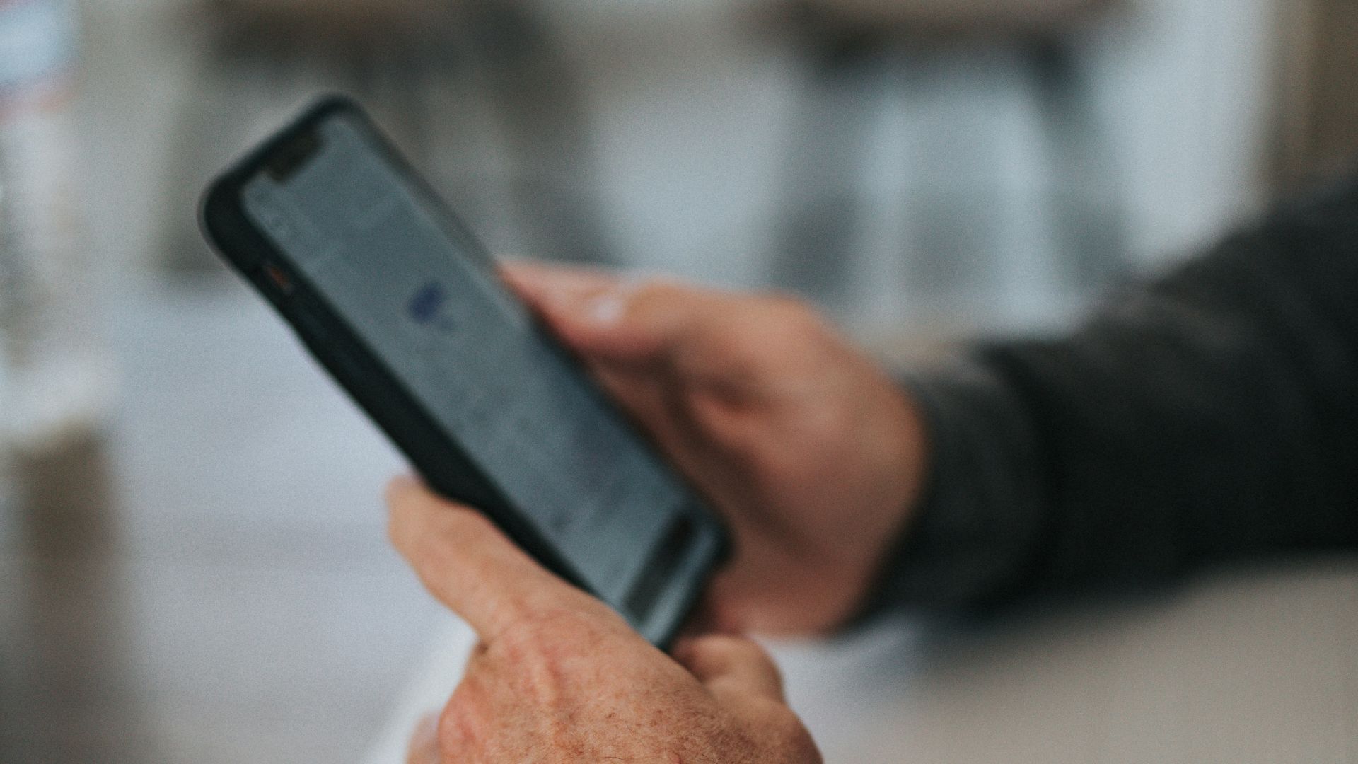 person holding black iphone 5